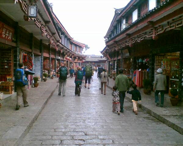 Traditional rooftops and canals of Lijiang Old Town in Yunnan at sunset