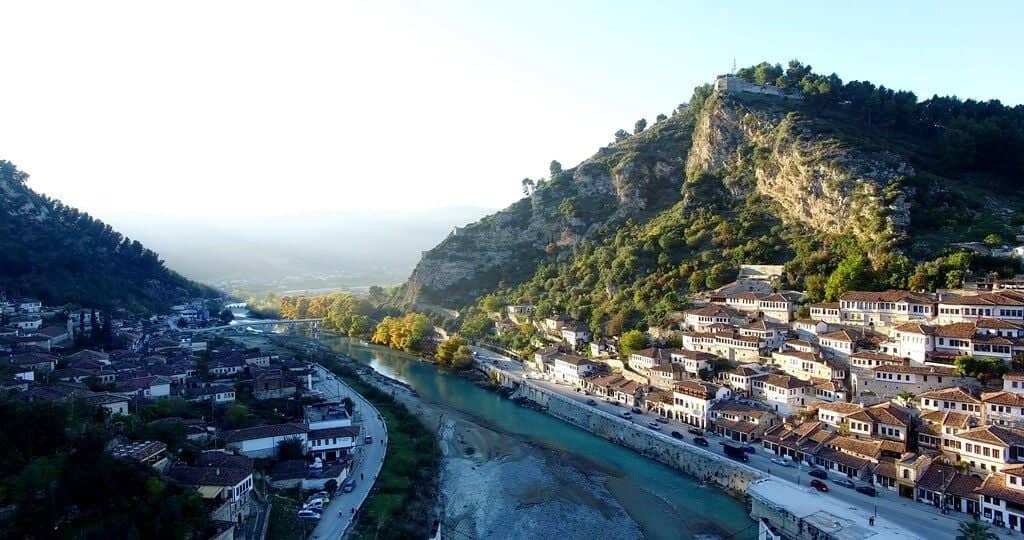 Traditional white Ottoman houses of Berat stacked on a hillside, known as the city of a thousand windows