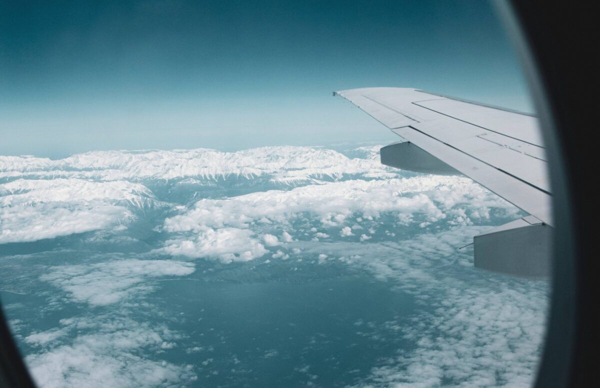 Traveler with backpack walking into the departure hall of Tribhuvan International Airport in Kathmandu