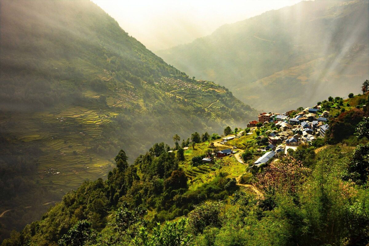 Trekking path near Nayapul with stone steps, terraced fields and traditional houses in the Annapurna foothills