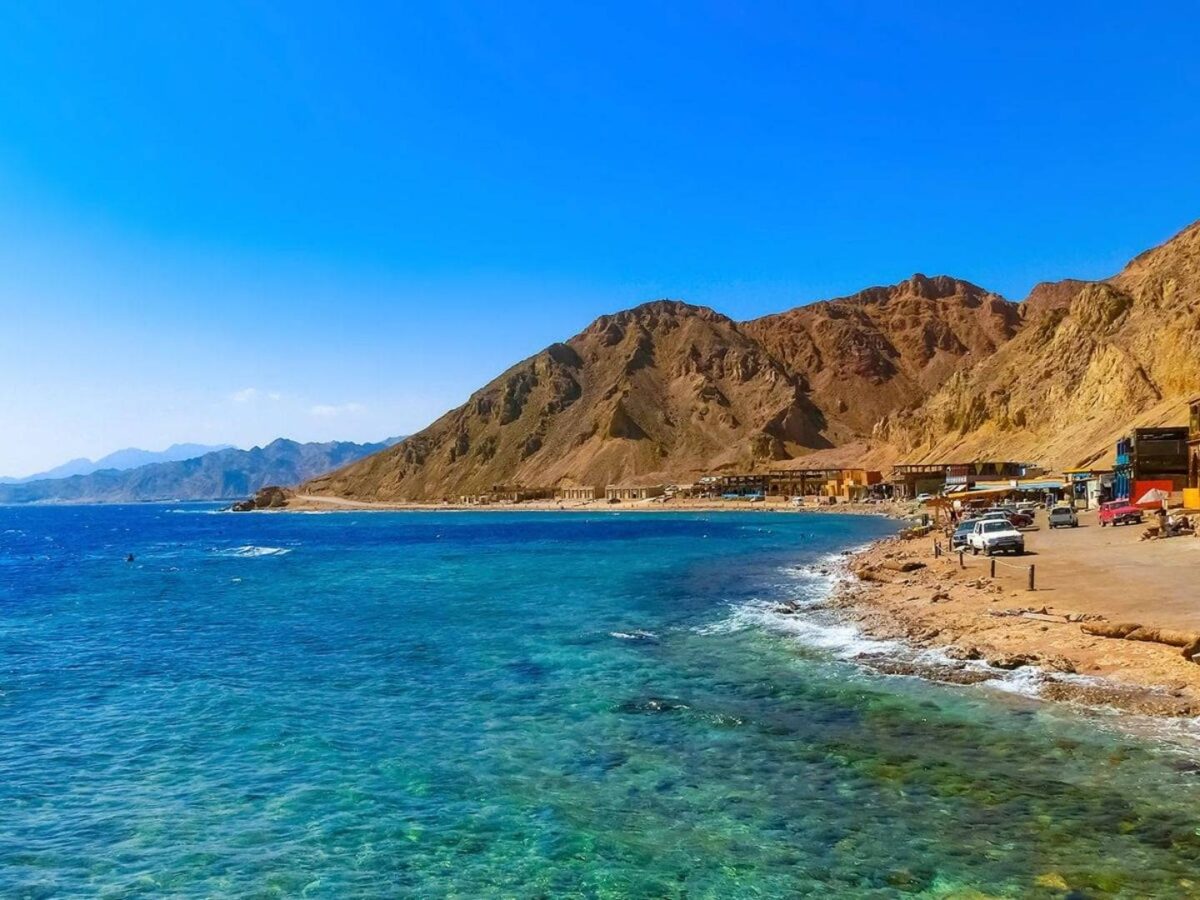 Turquoise waters and sandy beach of El Ain Sokhna on the Red Sea with resort facilities