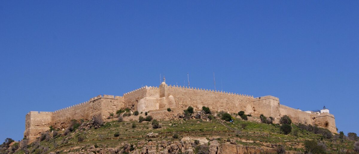 View from Kelibia fortress over the turquoise sea, sandy beach and fishing boats on the Cap Bon peninsula