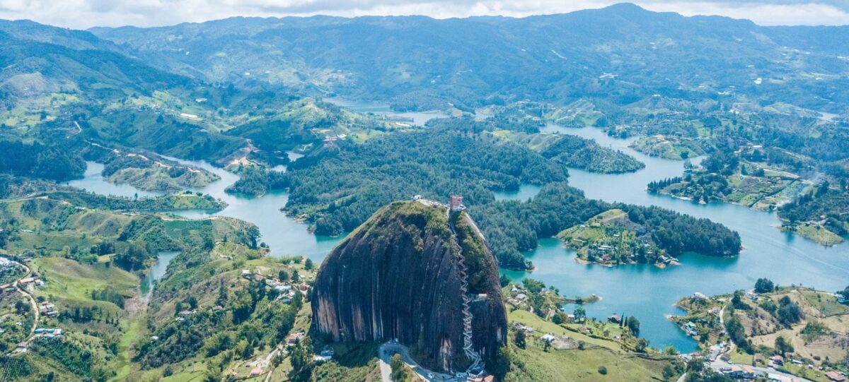 View from the top of Piedra del Peñol over the turquoise reservoir and green peninsulas near Guatapé