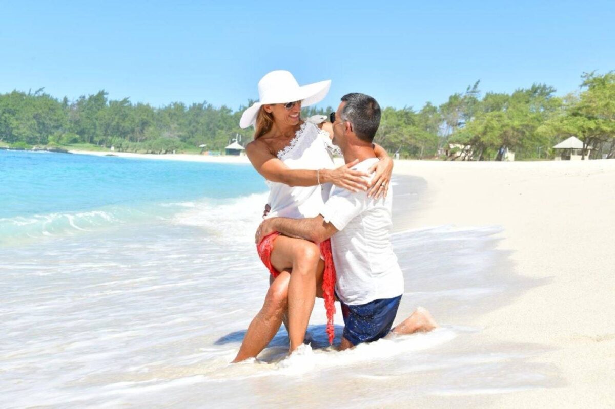 View of Cap Malheureux’s red-roof church facing a turquoise lagoon and Coin de Mire islet