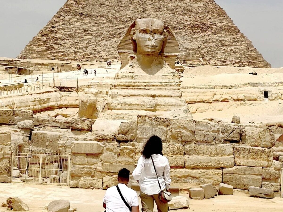 View of the Giza pyramids complex with the Great Sphinx in the foreground