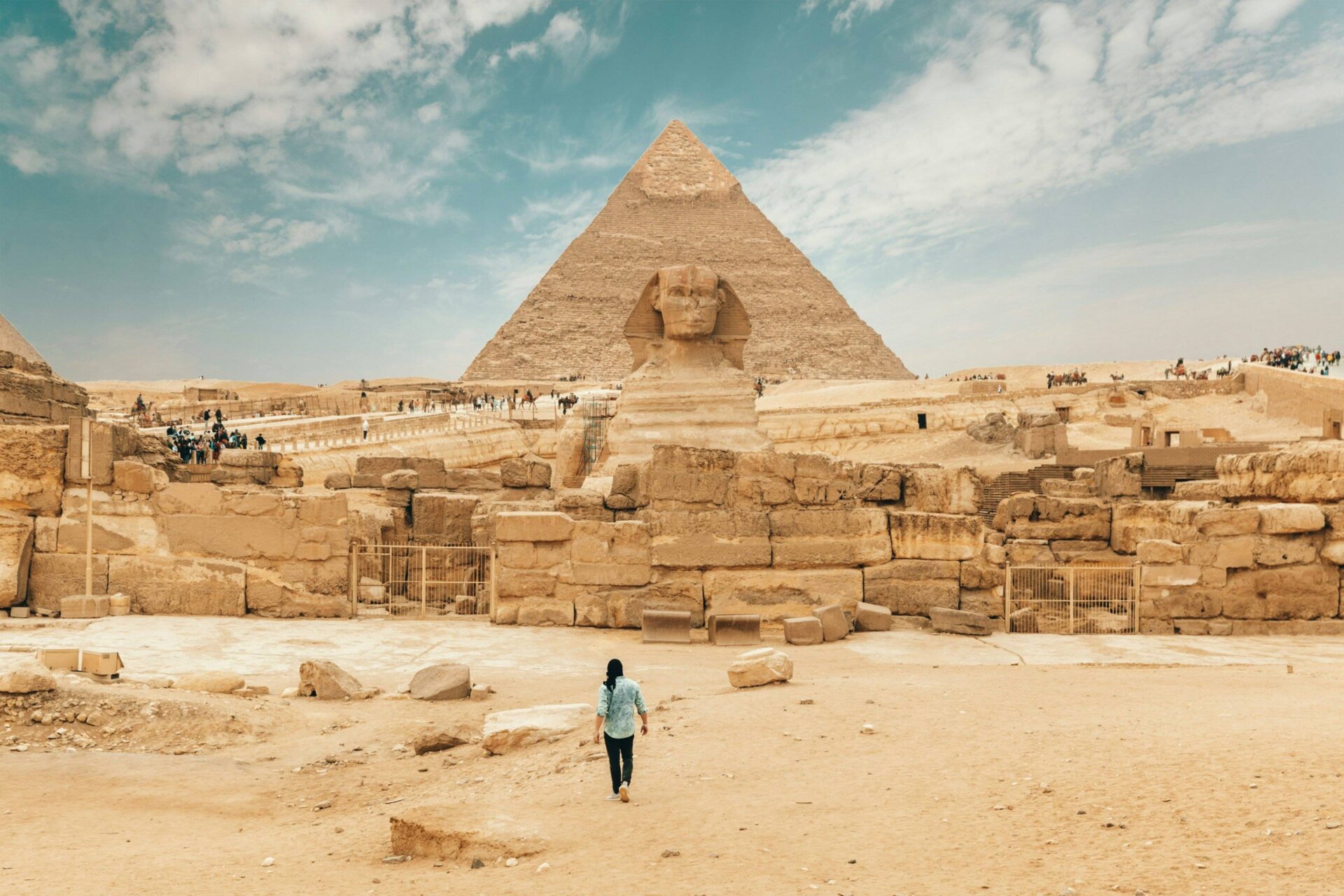 View of the Pyramids of Giza and the Sphinx near Cairo under a clear blue sky
