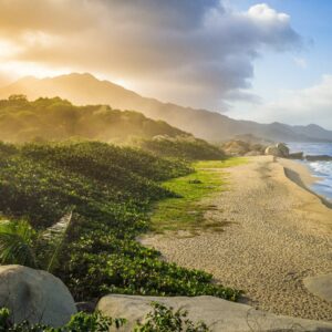 View over Cartagena de Indias’ colorful colonial old town with church towers and city walls along the Caribbean Sea at sunset