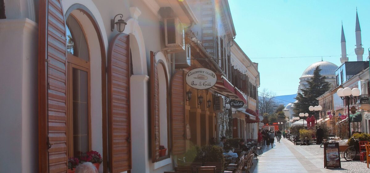 View over Shkodër with traditional houses, minarets and surrounding mountains in northern Albania