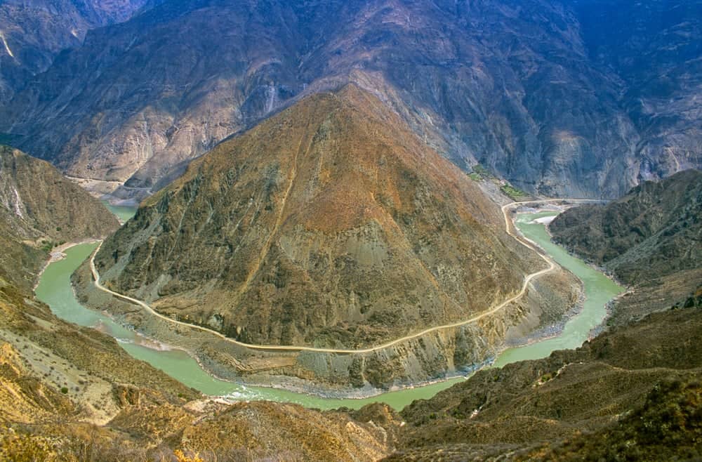 View over Tiger Leaping Gorge and the Jinsha River with high snow-capped peaks in the background