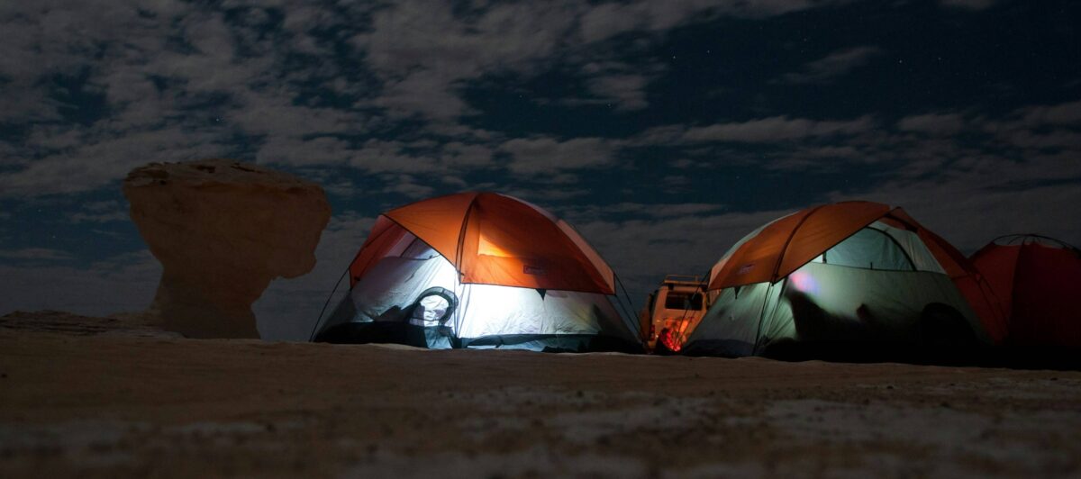 White Desert in Egypt with surreal white rock formations glowing at sunset