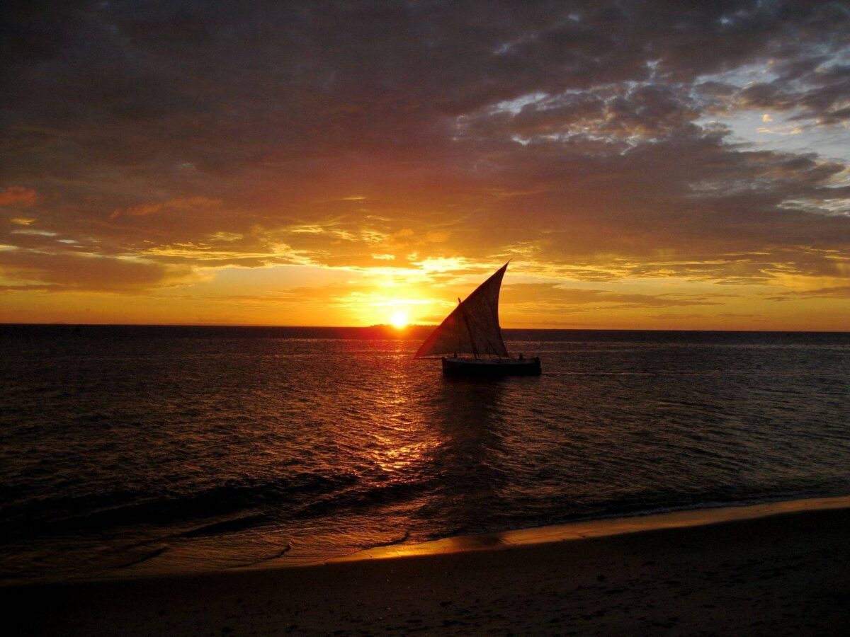 White-sand beach and turquoise waters at Jambiani on Zanzibar Island with palm trees swaying in the breeze